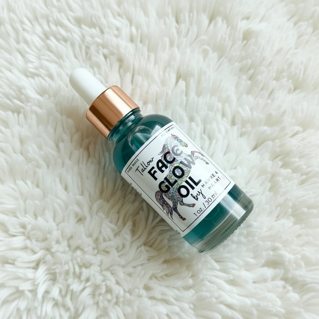 Bottle of 'Face Glow Oil' on a fluffy white surface
